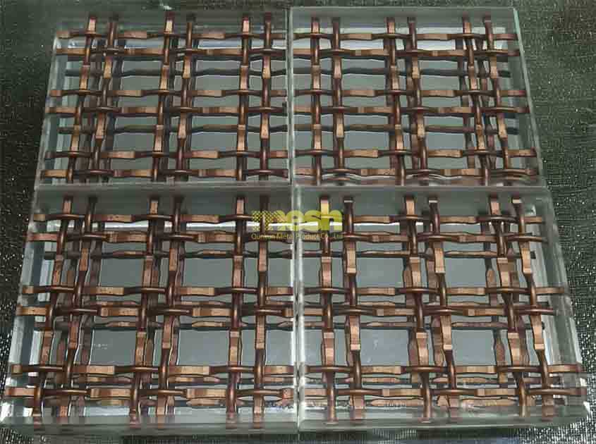 What types of metal mesh are commonly used in laminated glass